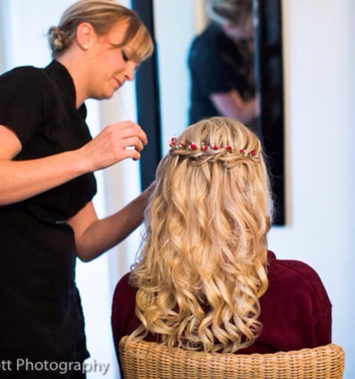 Bridal stylist Paula Marie doing a beautiful waterfall plait and soft curls in brides hair